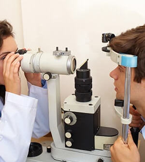 Man during eye exam with optom